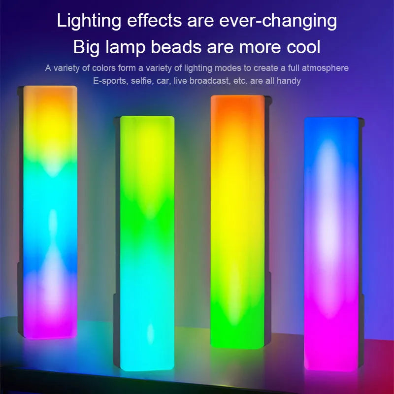 3D RGB table lamp with colourful rhythm lighting on desk beside gaming PC