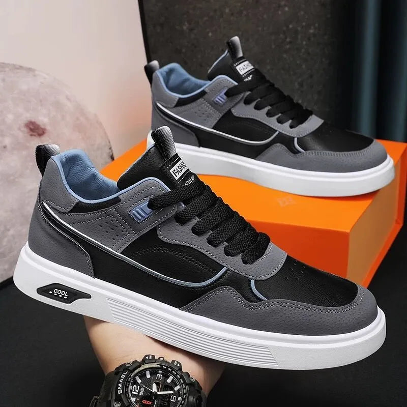 Men's low-top canvas board shoes in solid colour with leather stitching detail on a neutral background.