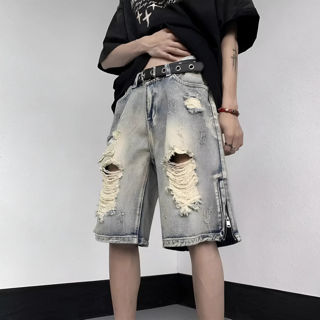 Blue retro tattered denim shorts with a wide leg loose fit on a mannequin.