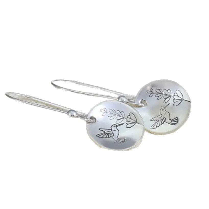 Silver zinc alloy women's earrings with bird and leaf design in circular retro style