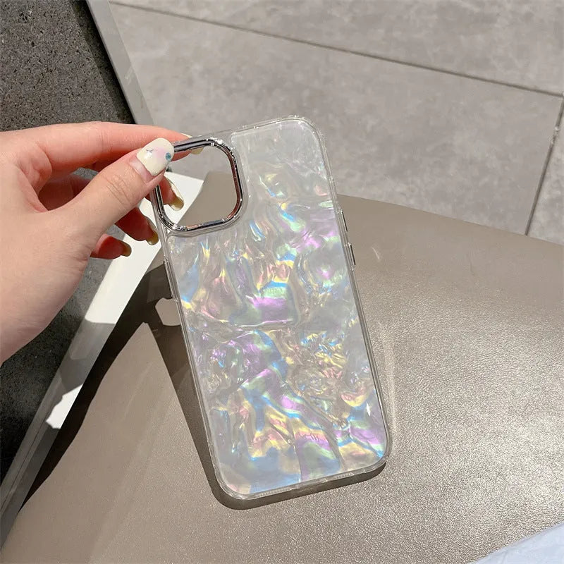 White TPU phone case with fantasy shell pattern compatible with iPhone 13 showing back design and side buttons