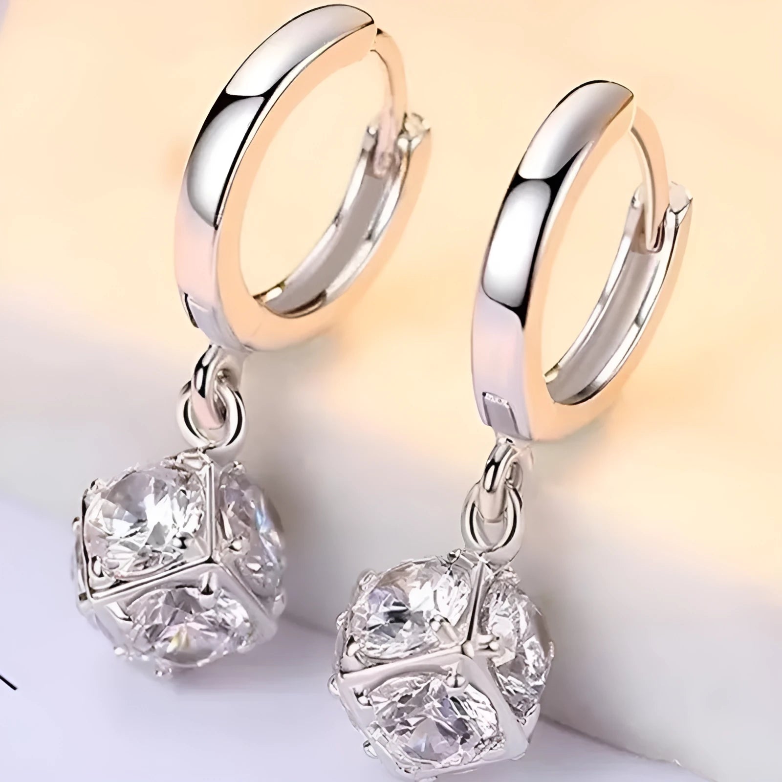 Geometric copper earrings with rose design elements and zircon detail in silver electroplated finish