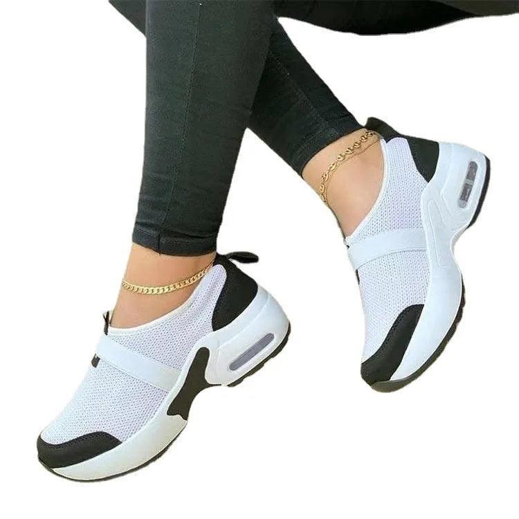 Women's flat mesh sneakers in light grey with a round toe and shallow opening, featuring a non-slip rubber sole.
