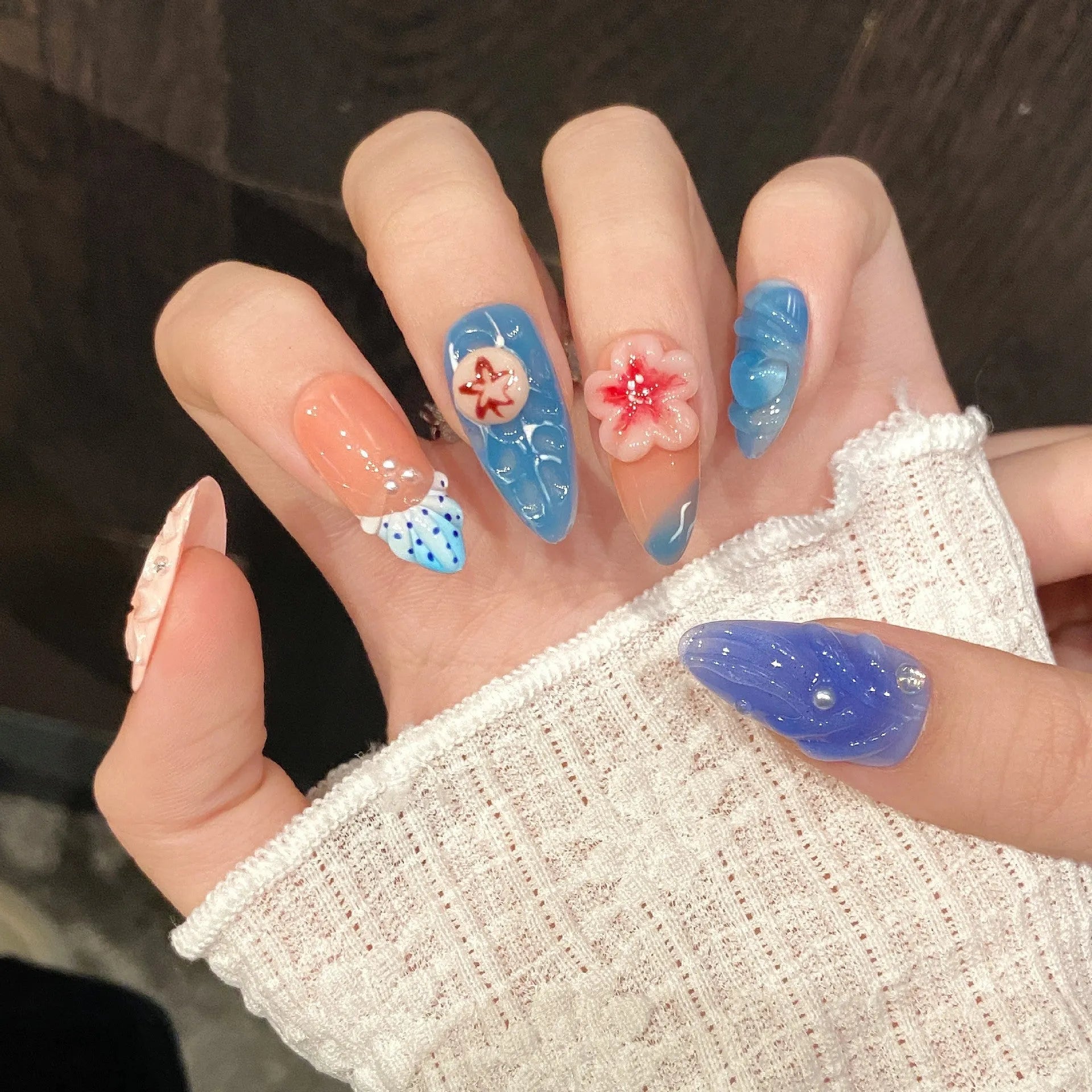 Three-dimensional carved jellyfish plastic wearable armour set in 672 almond nail colour with marine floral patterns.