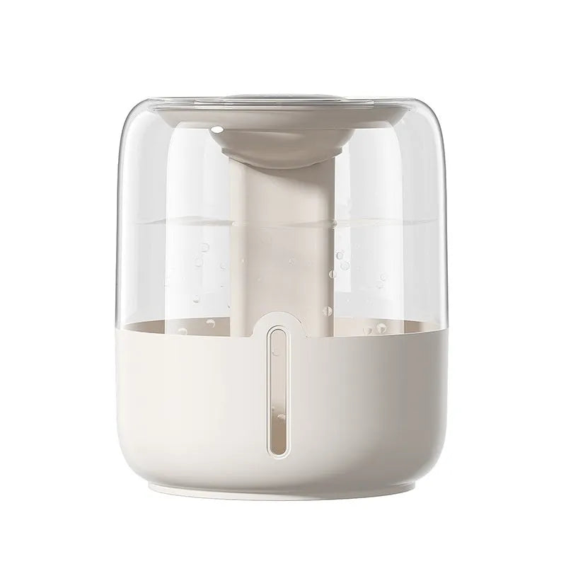 Beige round USB humidifier with dual spray nozzles and digital humidity display on a desk