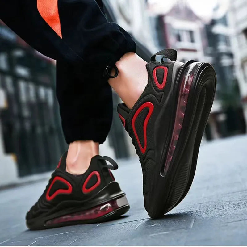 Men's black lace-up sneakers with thick sole and round toe on a white background