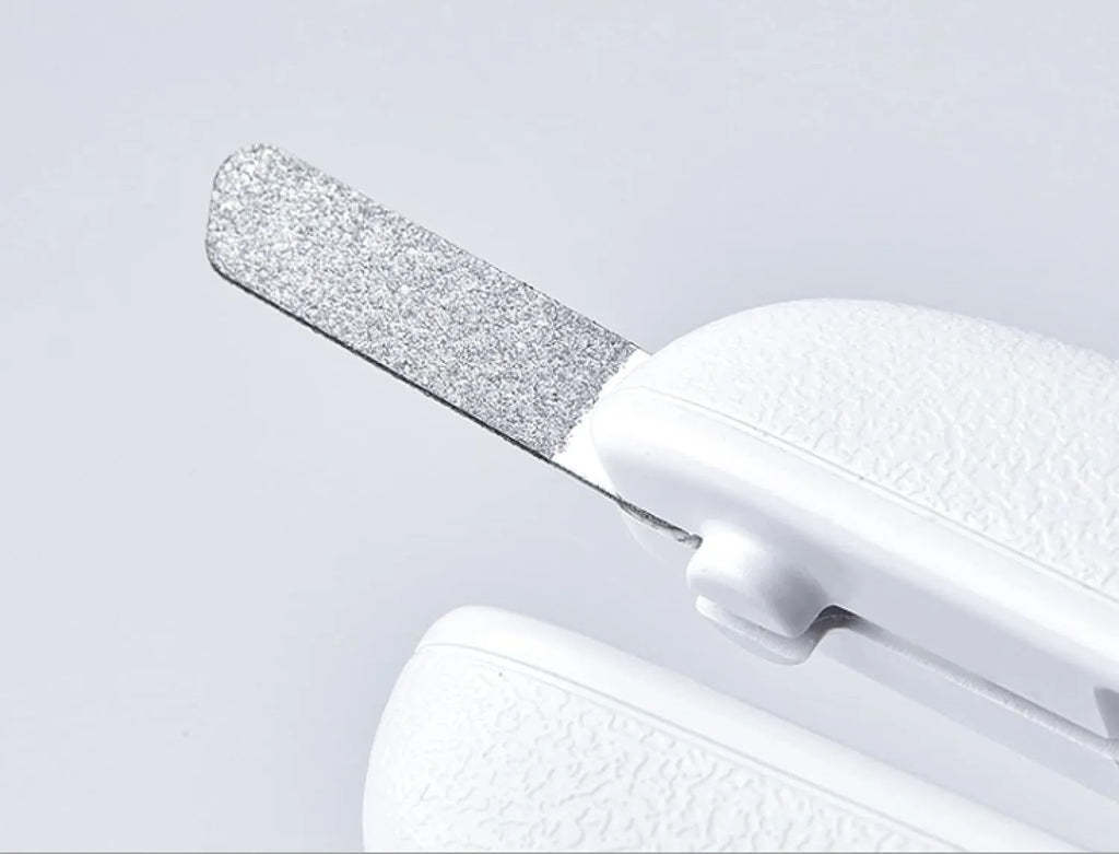 White pet nail clippers with LED light, anti-splash transparent guard, and a leather-like handle on a blue background.