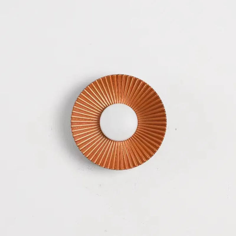 Round aluminium LED wall lamp in a choice of six colour finishes for bedroom or living room.