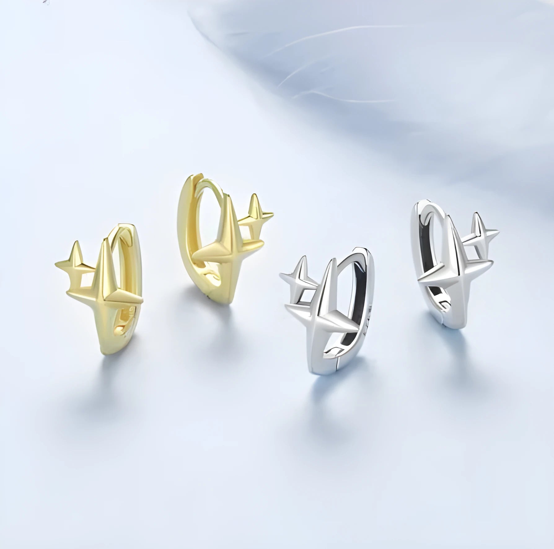 Minimalist sterling silver star ear clips with XINGX elements and oxidation treatment