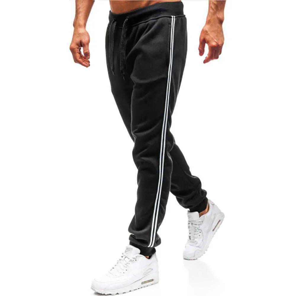 Men's summer casual loose tapered sports trousers in black with elastic waist, drawstring, and stitching details