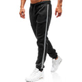 Men's summer casual loose tapered sports trousers in black with elastic waist, drawstring, and stitching details