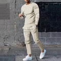 Men's light grey polyester two-piece suit with long sleeve t-shirt and trousers on a hanger.