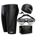 Men's black five-piece swimming set showing trunks, goggles, cap, ear plugs, nose clip, and storage bag