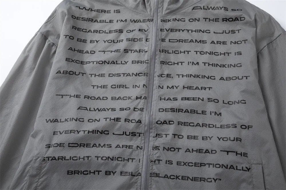 Men's nylon sun protection jacket with letters print in gray, shown on a model