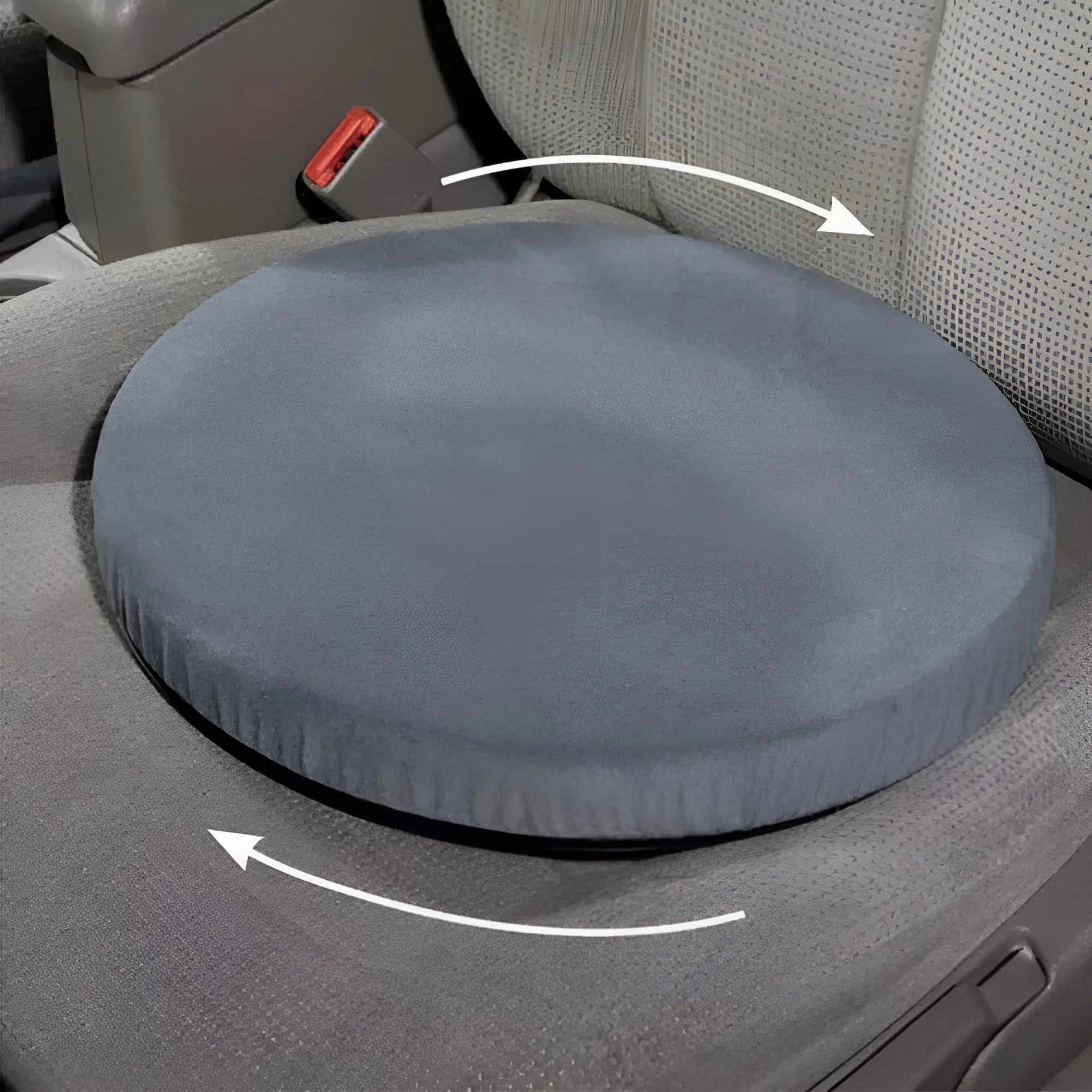 Circular grey rotating car seat cushion for elderly passengers on a car seat