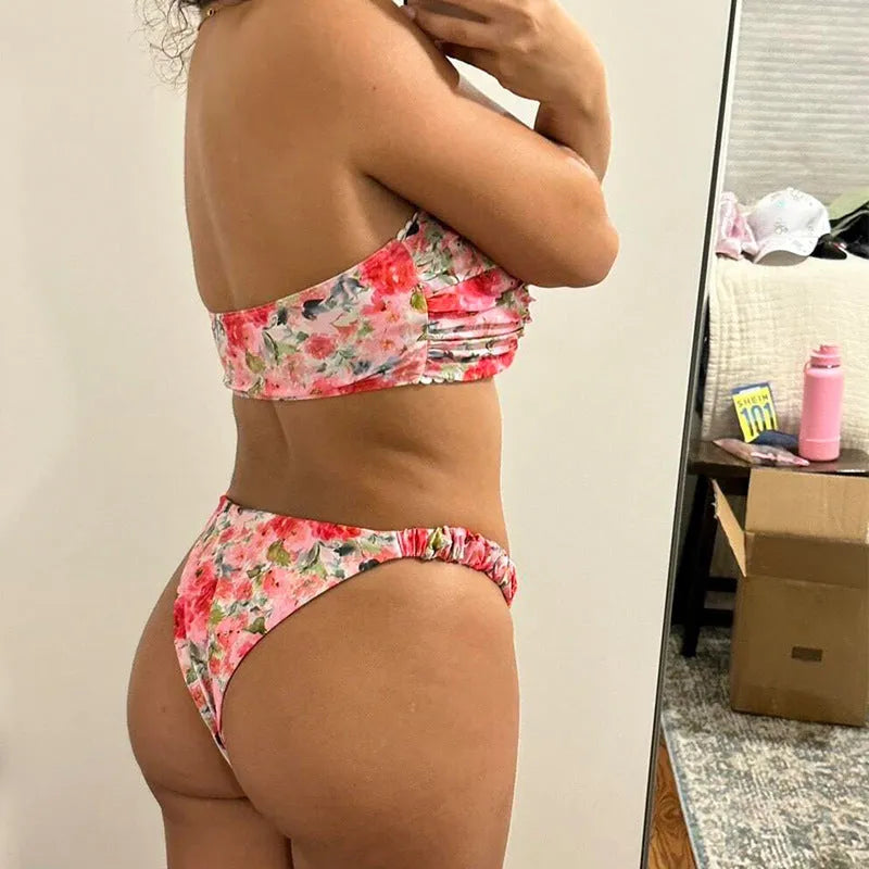A colourful floral print lace tube top bikini set with matching shorts on a mannequin.
