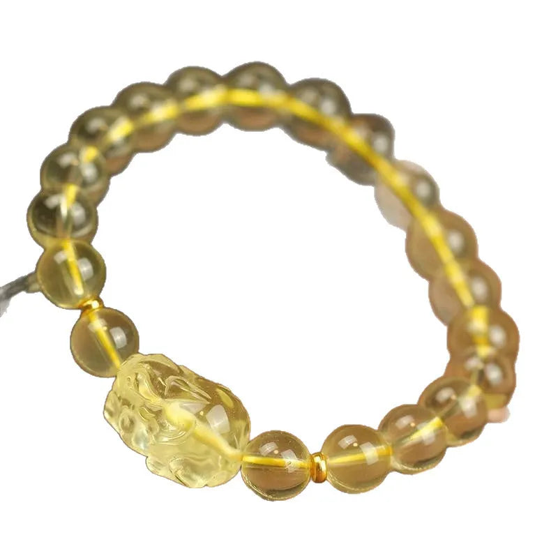Yellow leather bracelet with artificial citrine crystals and a traditional Chinese Pi Xiu charm.