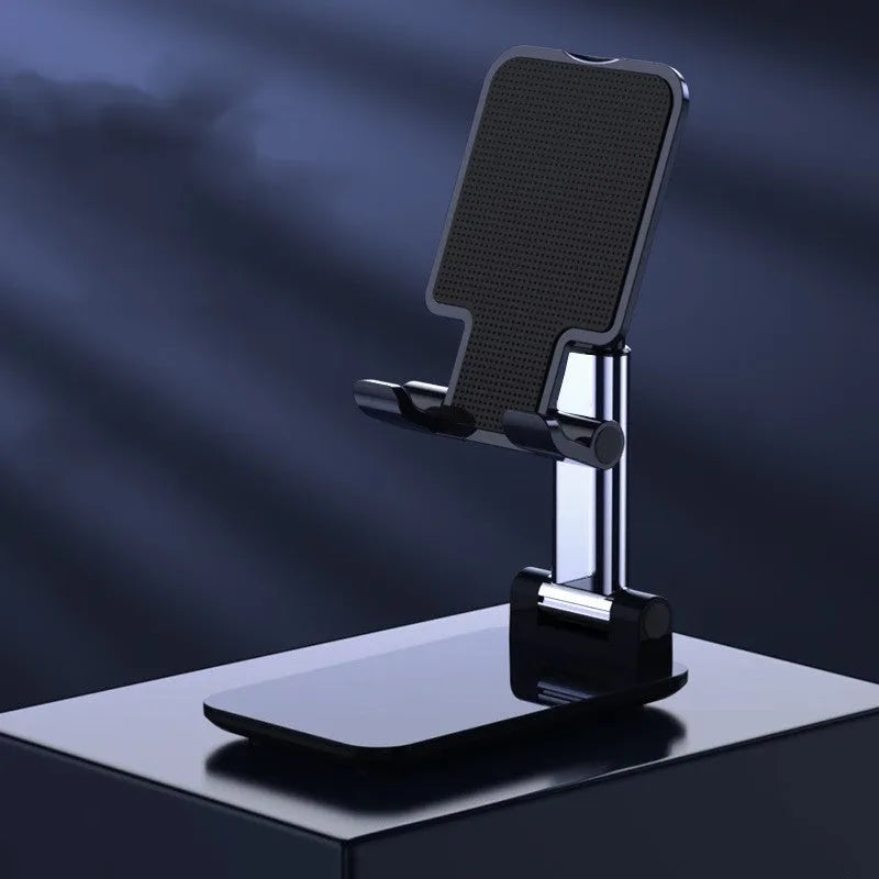 Live Selfie folding telescopic mobile phone bracket in white with silicone pad on desktop