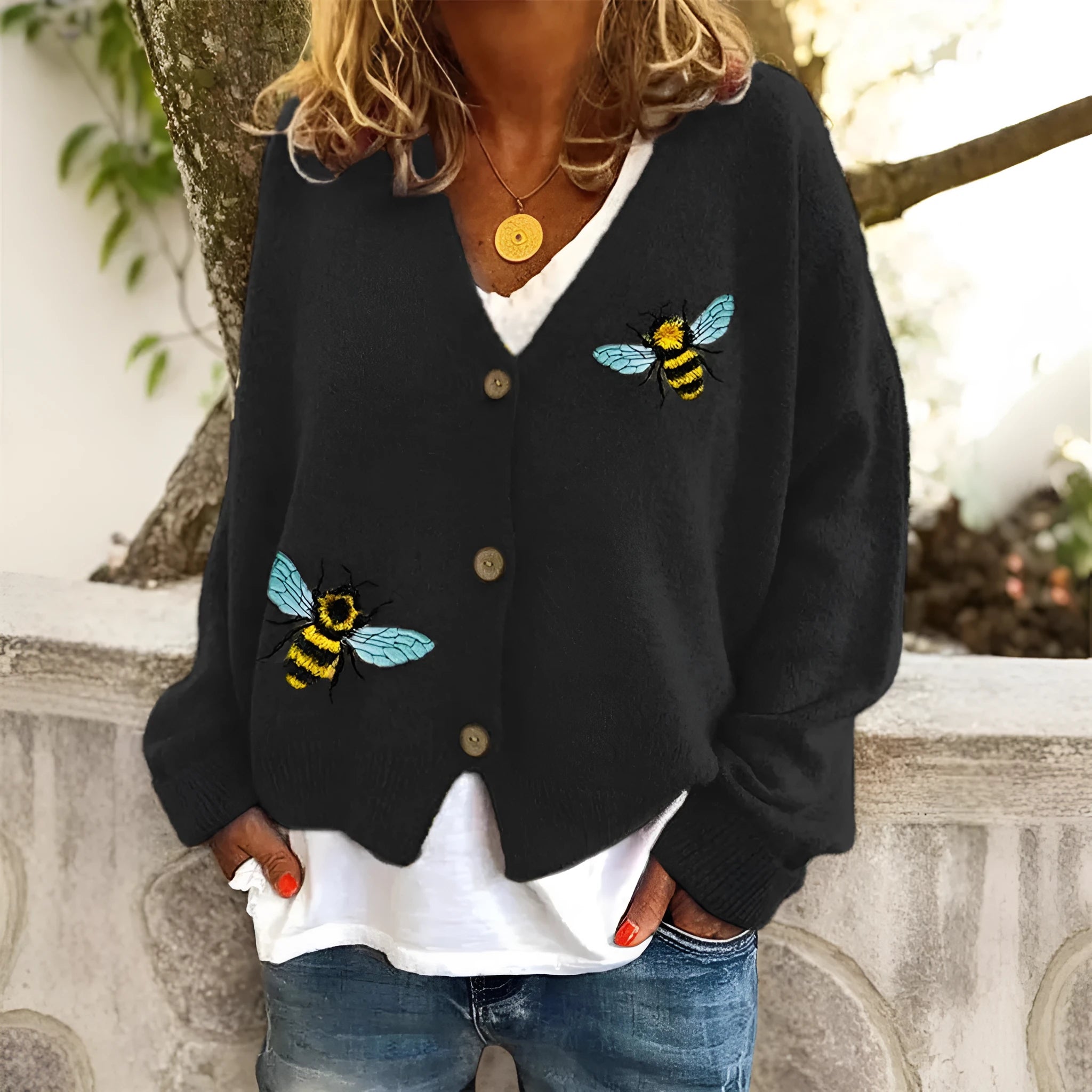 Loose fit animal pattern knitted cardigan sweater in black, made from polyester, with conventional sleeves.
