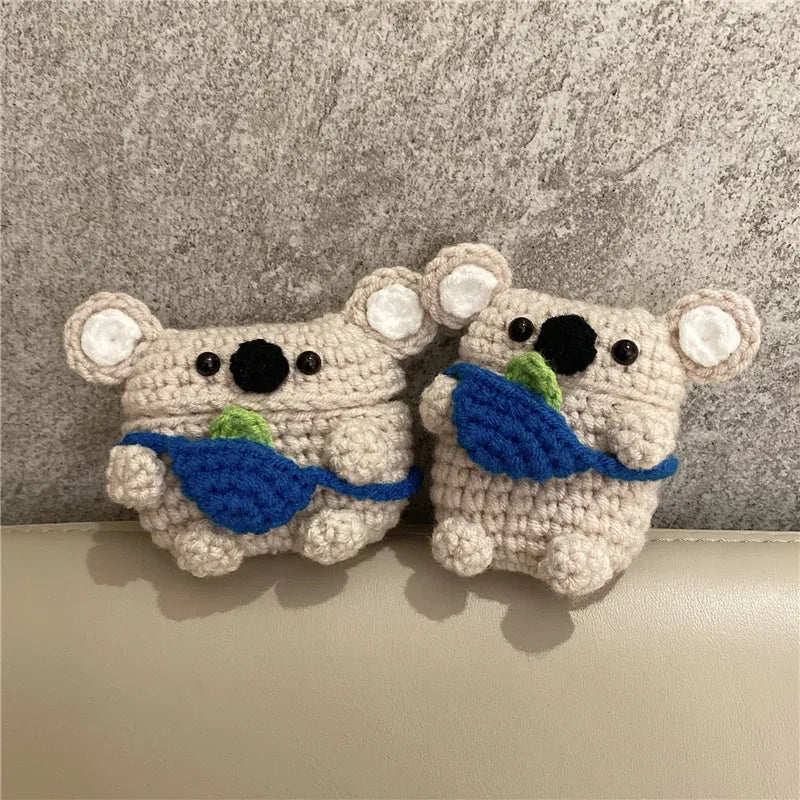 Handmade knitted AirPods protective cover with backpack koala bear design showing front and side views