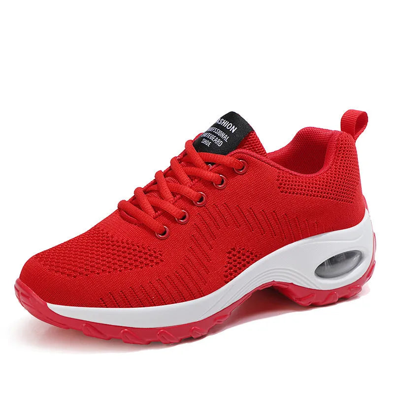 Women's black mesh lace-up sneakers with round toe and mid heel on white background