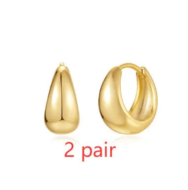 Brass geometric earclip earrings with electroplated gold finish and round design element