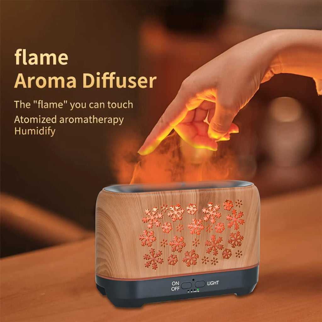 Colourful snowflake wood grain aromatherapy humidifier with glowing flame effect on a desktop.