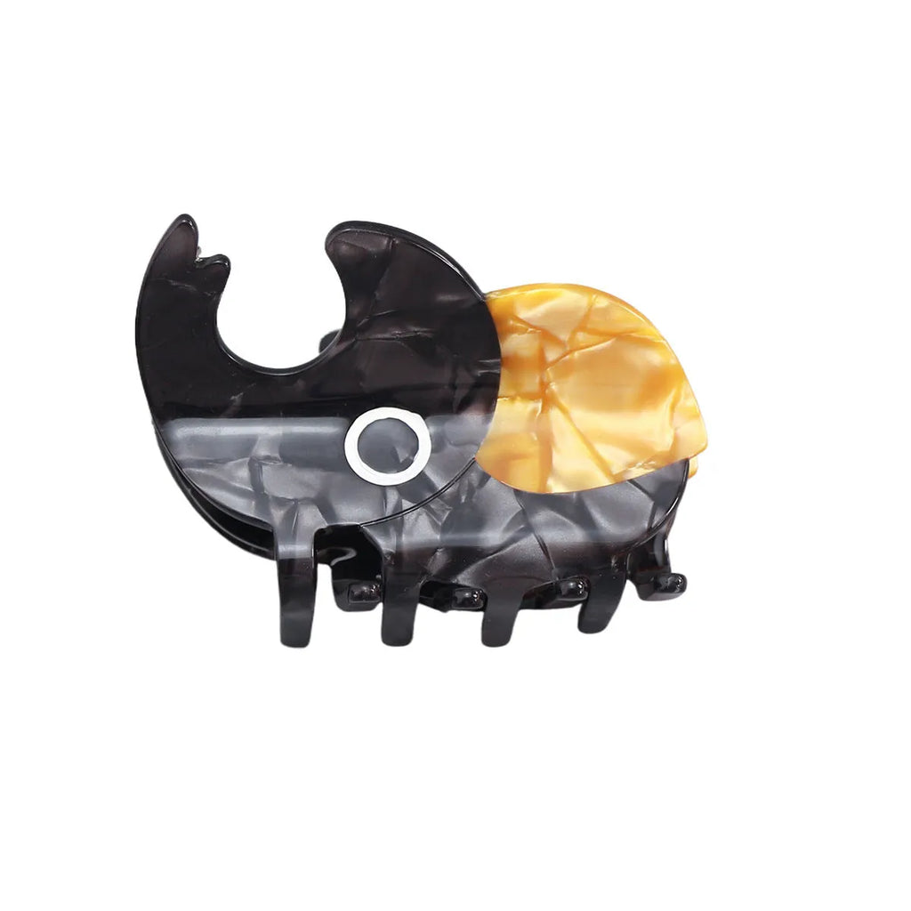 Handmade cellulose acetate beetle grip hair clip with cartoon caterpillar design in green, orange and white colours