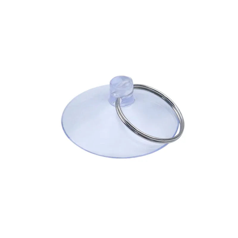 PVC suction disc hooks in assorted sizes and styles including iron hooks and key ring sucker on a glass surface