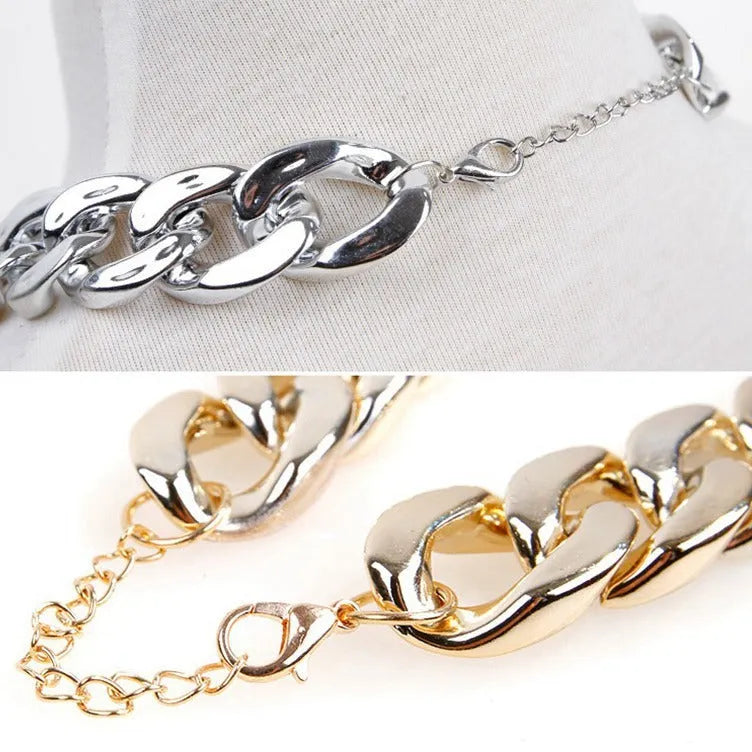Gold chain dog collar necklace with a geometric buckle on a small dog