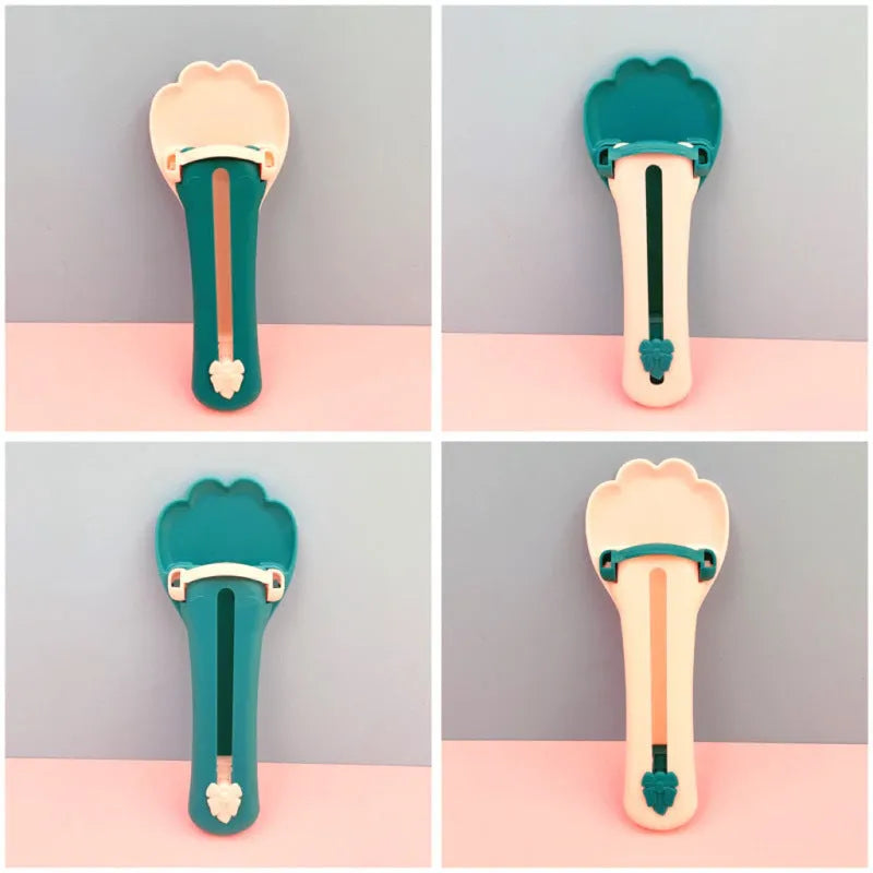 Green and pink pet food extrusion scoop with a squeezer dispenser for cat and dog treats