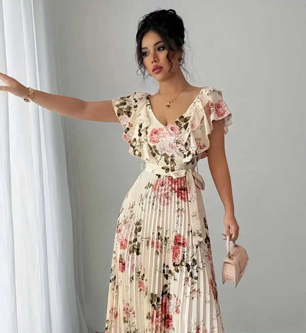 Apricot floral print dress with V-neck, ruffled sleeves, and a swing skirt.