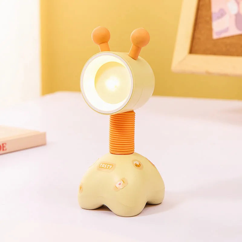 DIY cartoon magnetic small night lamp in assorted animal styles and colours on a desktop.