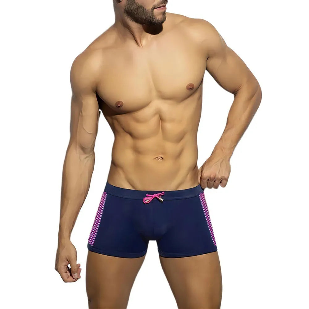 Men's polka dot print swimming boxers in quick-dry nylon fabric on a size chart.