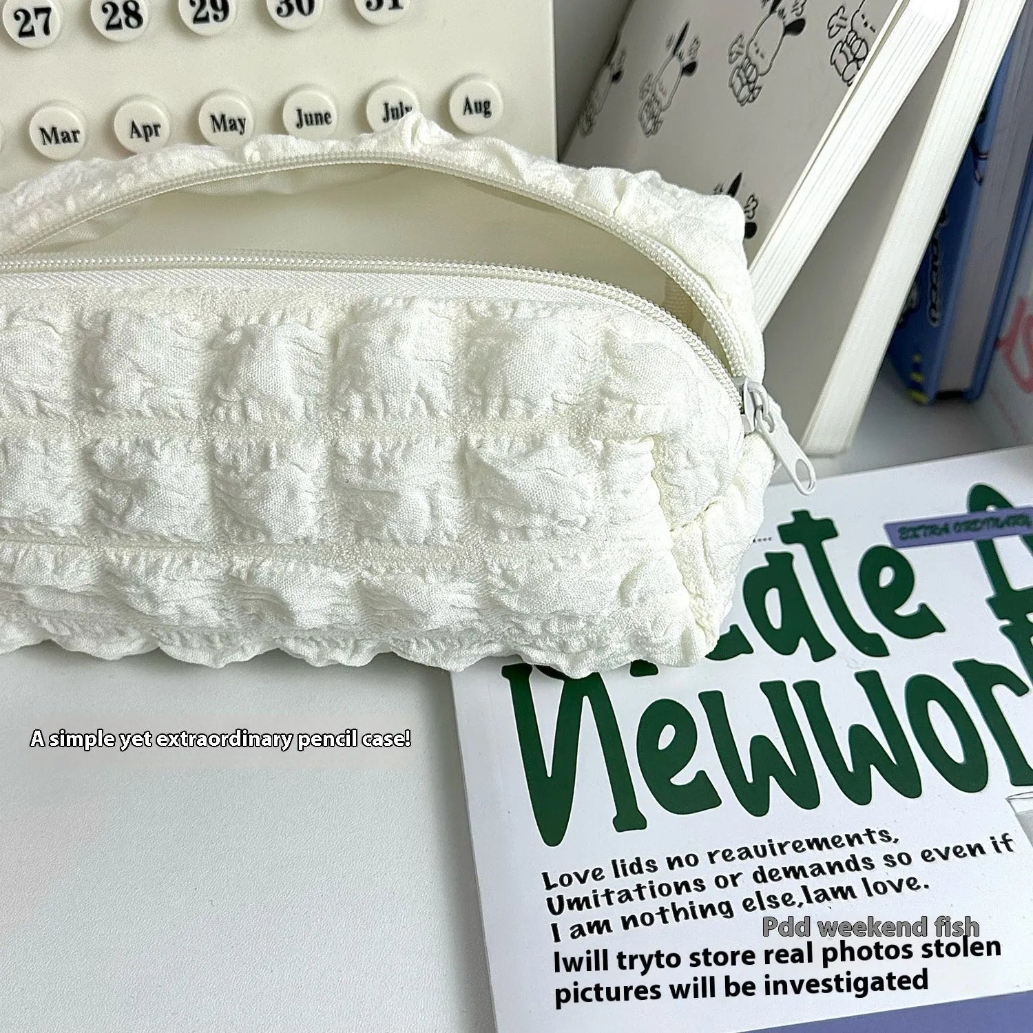 Cream puff style fabric pencil case in polyester construction showing beige and black colour options