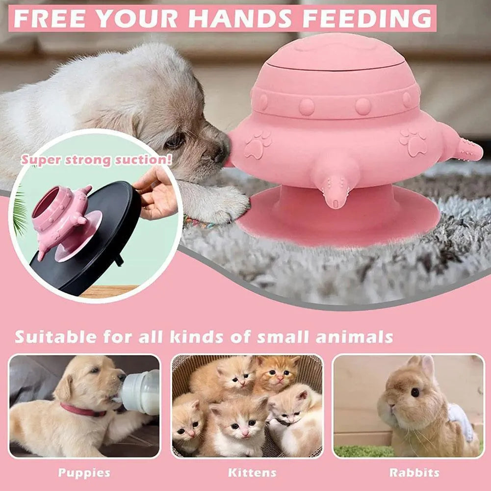Pink silicone pet nursing bottle with bionic breast design and four pacifiers on a flat base.