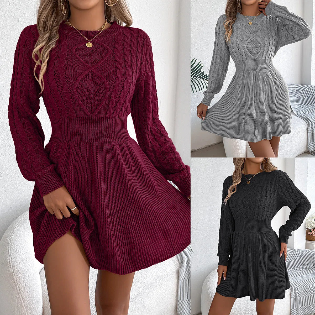 A woman wearing a wine red lantern sleeve sweater dress with an elastic waist.