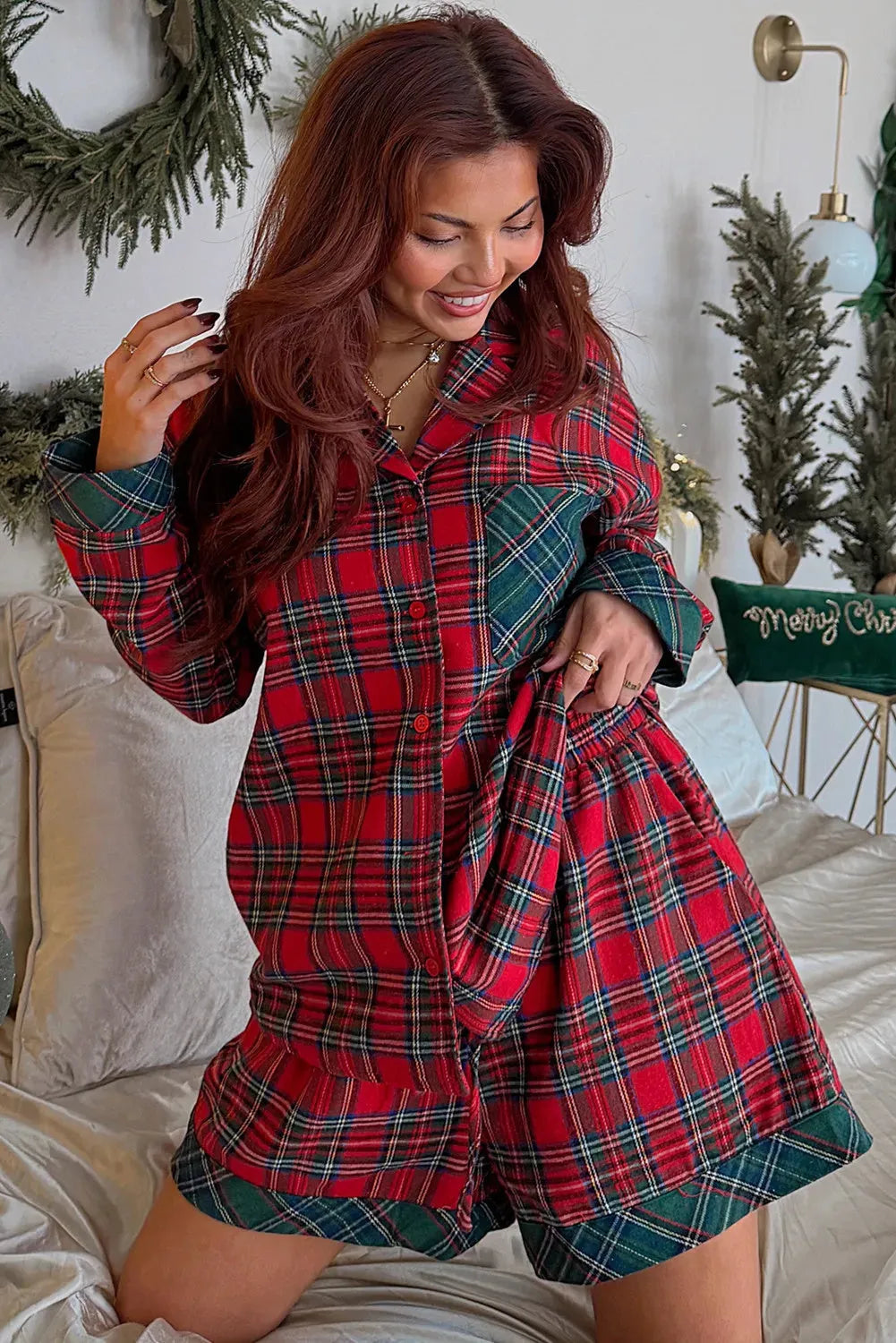 Red plaid Christmas pyjama set with long sleeve shirt and matching shorts in polyester-cotton blend fabric