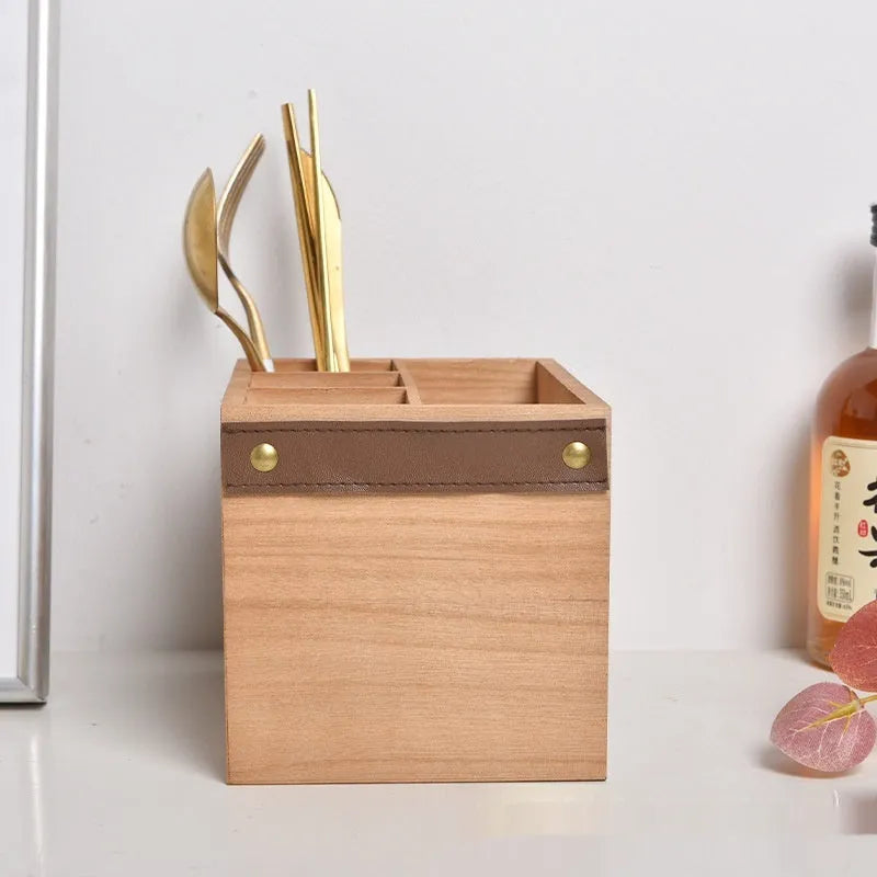 Open-top wooden kitchen storage box with internal grid divider for knives, forks, and chopsticks.