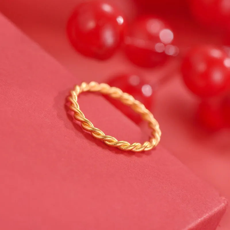 A brass gold plated women's ring in a simple bracelet design, shown in glossy, matte, and twist style variations.