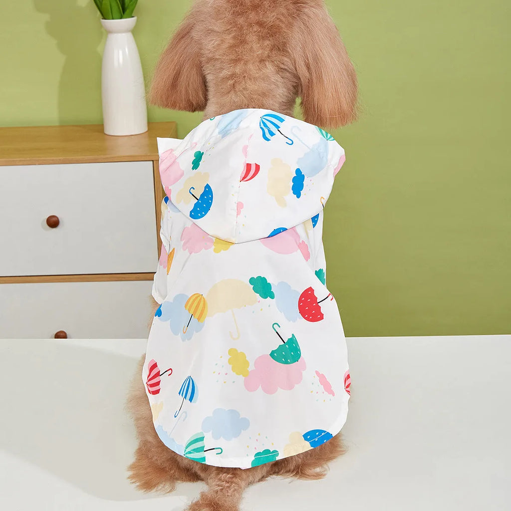 Colourful cartoon umbrella pattern pet raincoat for a small dog on a grey background.