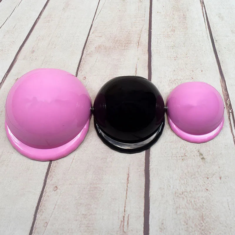 Plastic dog motorcycle helmet shown in multiple solid colours including pink, blue, and yellow, with size examples.