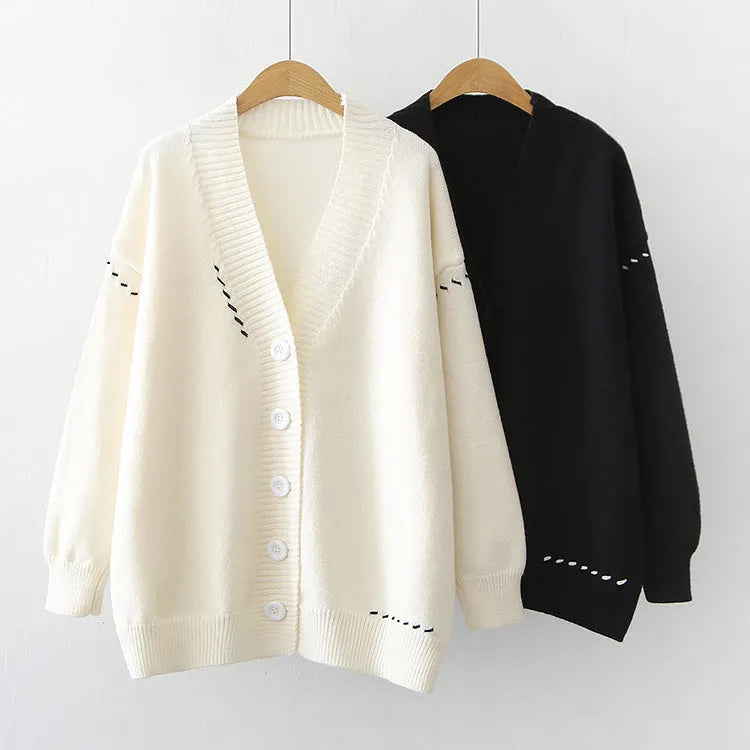 Women's knitted cardigan coat in black with loose fit and long sleeves
