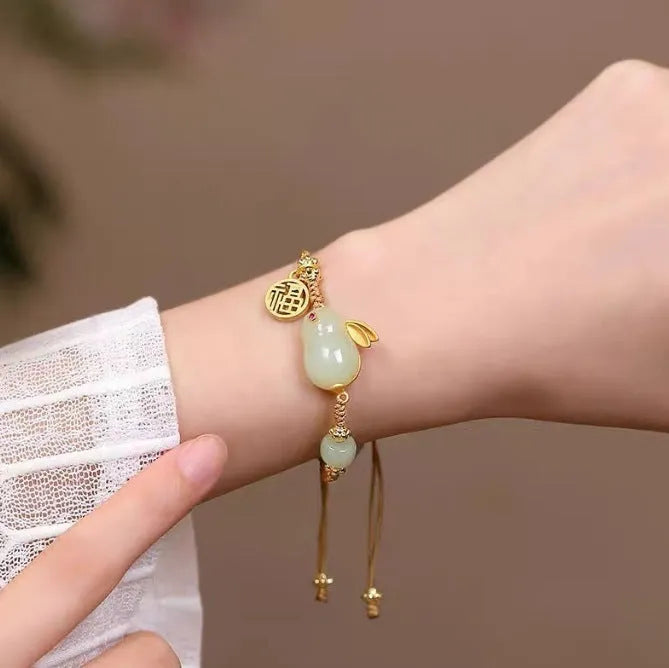 Women's rabbit bracelet with Hetian jade geometric charm on yellow string