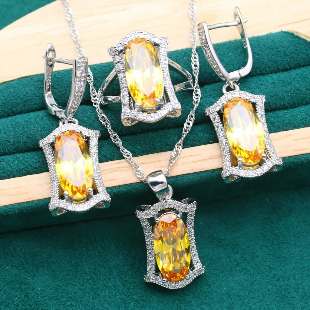 Yellow and olive alloy zircon jewellery set for women showing necklace, earrings, ring, and bracelet on display.