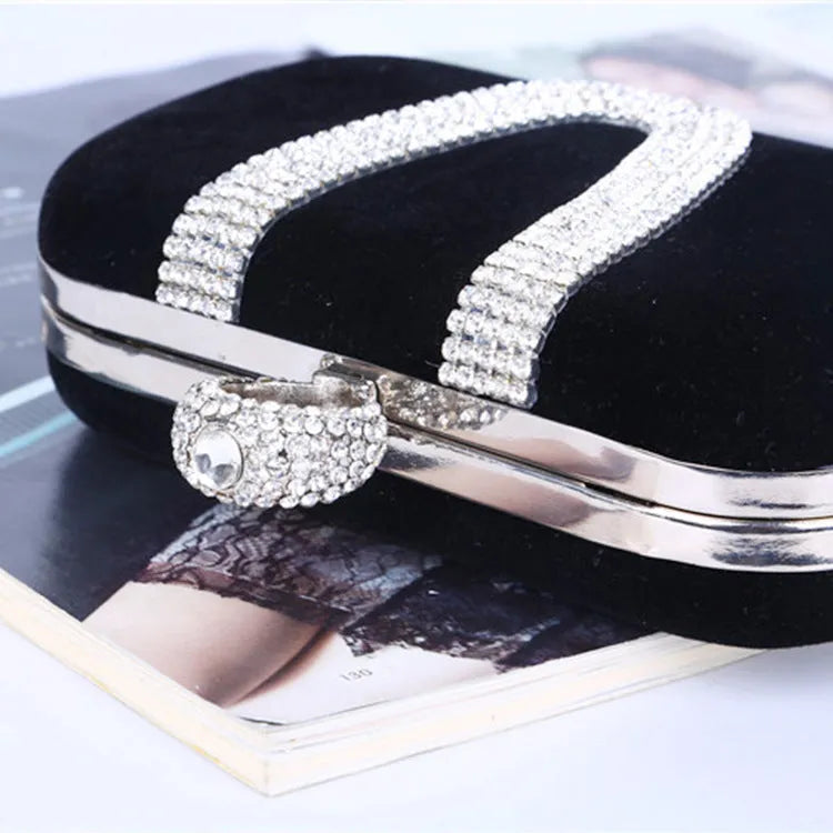 Small velvet clutch evening bag with rhinestones, lock closure, and detachable handle in black