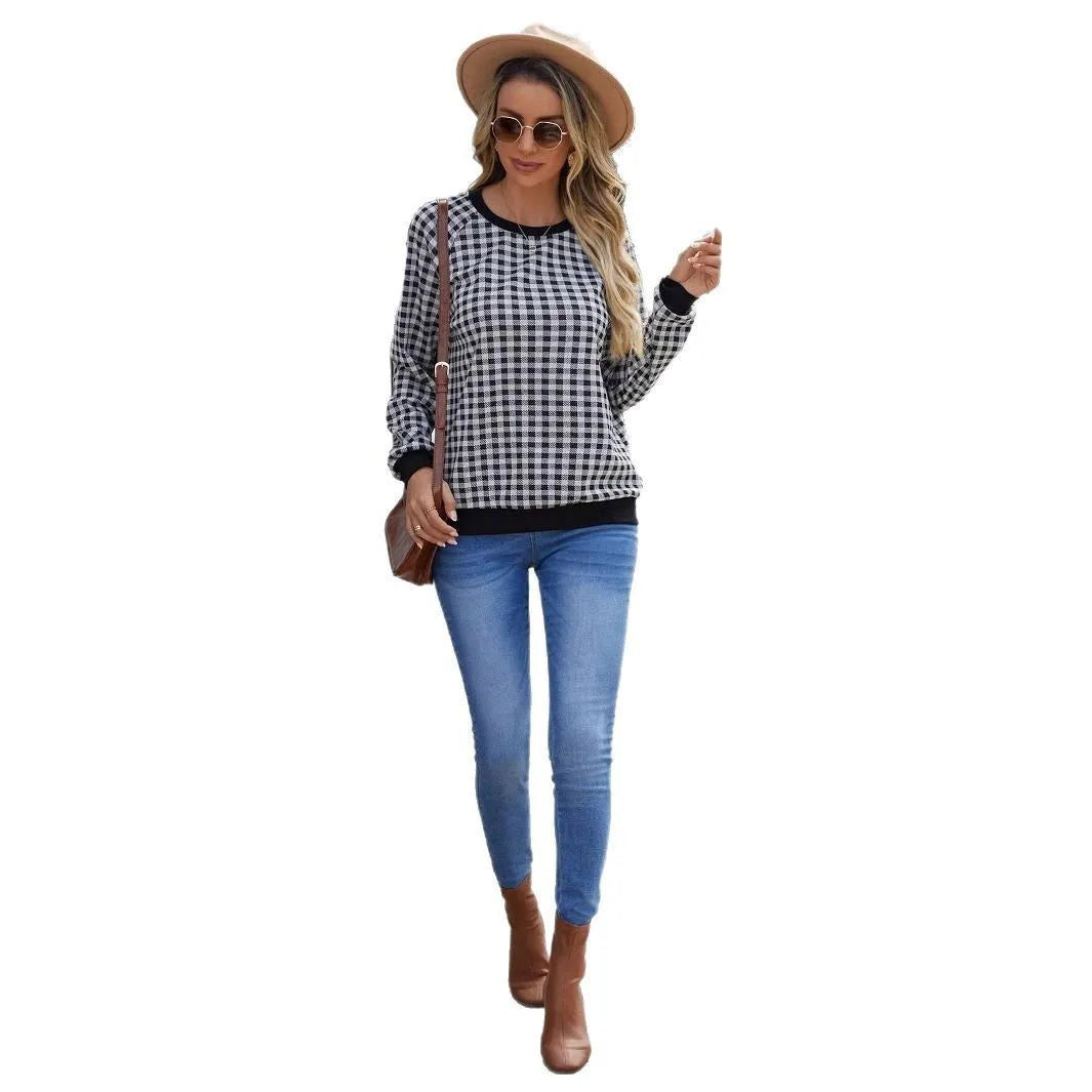 Black plaid striped long sleeve pullover sweater with printed design elements