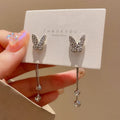 Silver alloy butterfly tassel earrings with geometric design, fresh style, on white background