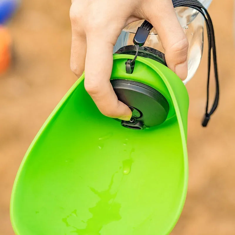 Blue plastic dog water bottle with drinking bowl showing key lock mechanism and 680ml capacity markings