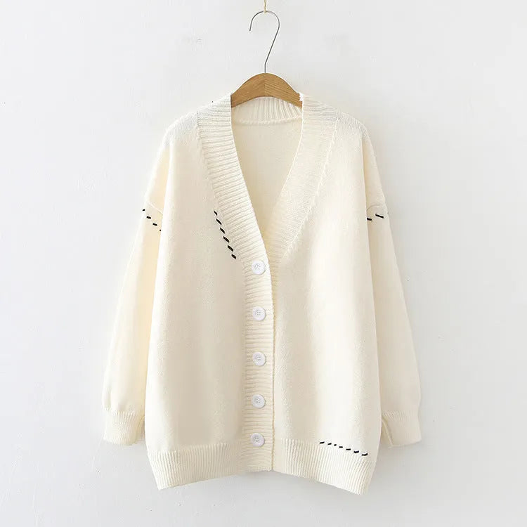 Women's knitted cardigan coat in black with loose fit and long sleeves